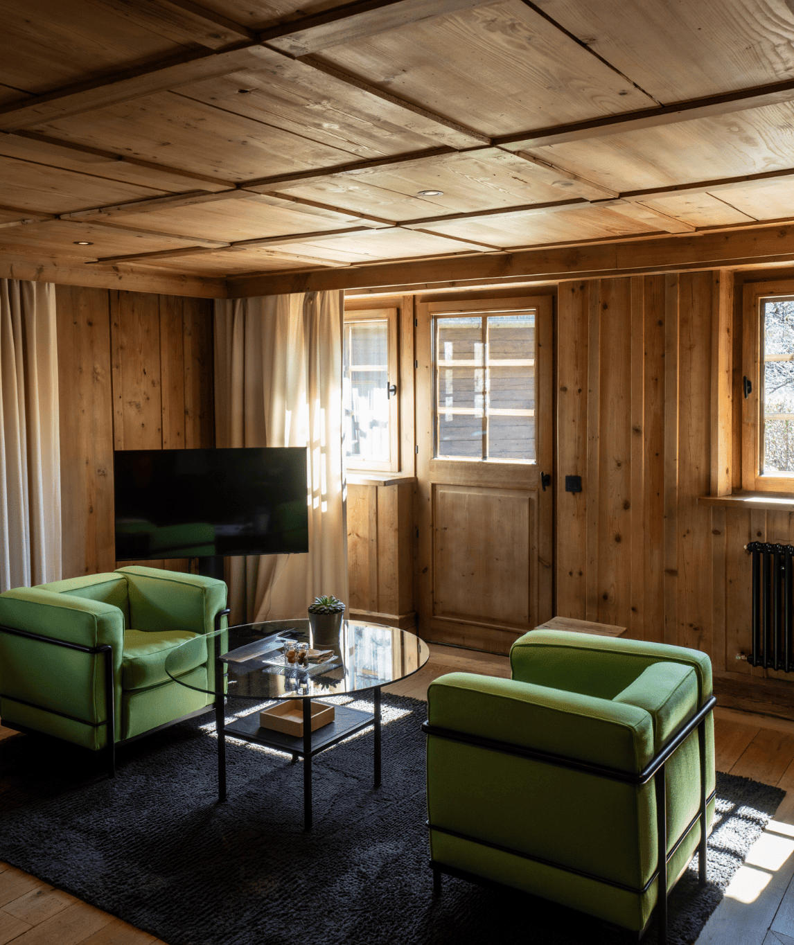 Coin salon et télévision de la chambre prestige à la ferme
